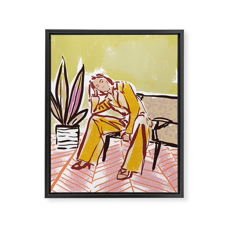 Woman sitting on sofa Framed Canvas Print Gallery Image 6