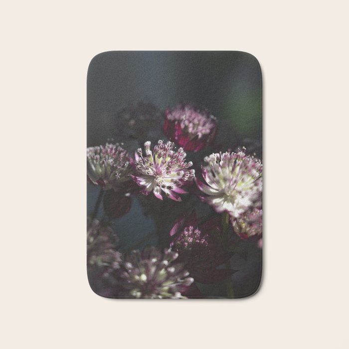 Full moon forest - still life dark astrantia major flowers - deep purple fall nature photography. Bath Mat Gallery Image 1