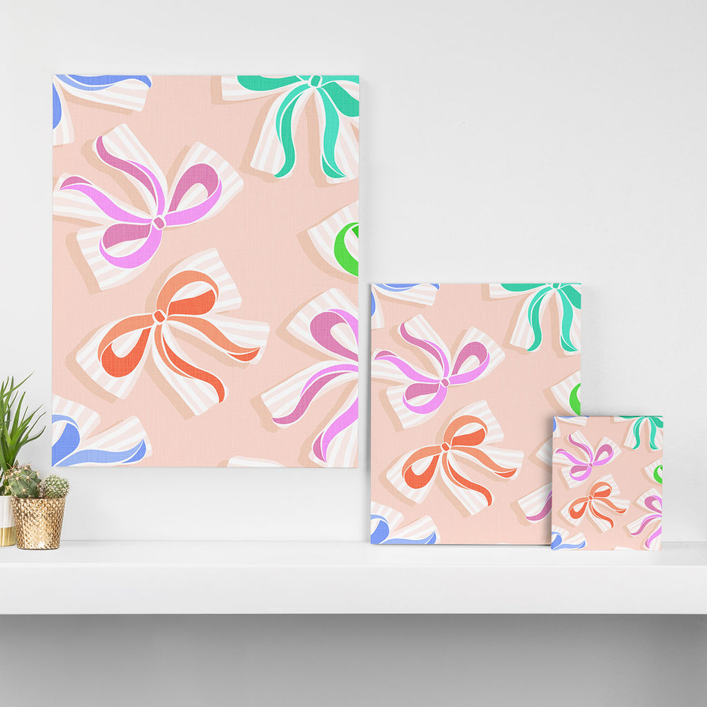 Ditsy Kitsch Ribbons and bows 1. Pastel Rainbow colours on Peach Canvas Print Gallery Image 3