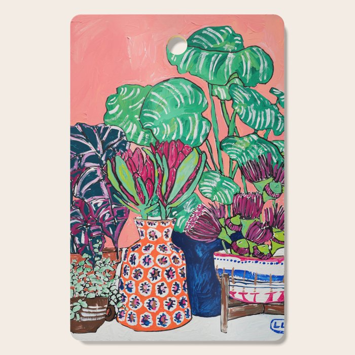 Cluster of Houseplants and Proteas on Pink Still Life Painting Cutting Board Gallery Image 1