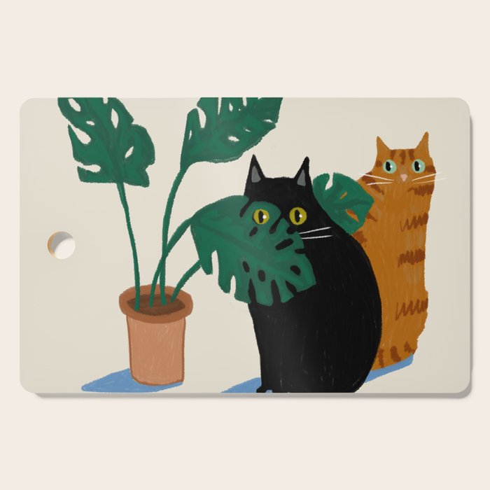 Black cat & orange tabby cat with Monstera plant Cutting Board Gallery Image 1