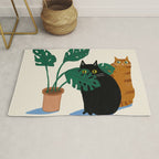 Black cat & orange tabby cat with Monstera plant Rug Gallery Image 1