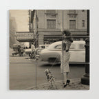 Young woman with pet dog hailing a yellow cab taxi New York City portrait black and white photograph - photography - photographs Wood Wall Art Gallery Image 1
