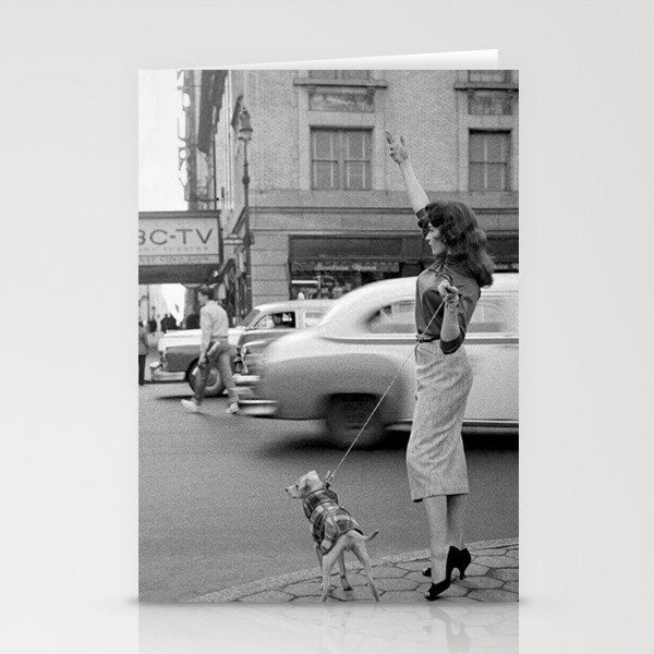 Young woman with pet dog hailing a yellow cab taxi New York City portrait black and white photograph - photography - photographs Stationery Card Gallery Image 1