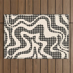 Retro Liquid Swirl Abstract Gingham Check Pattern in Black and Almond Cream Outdoor Rug Gallery Image 1