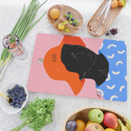 Squirt game hat in pink background and blue lines Cutting Board Gallery Image 2