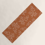 Delicate White Leaves and Branch on a Rust Orange Background Yoga Mat Gallery Image 1