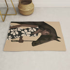 Woman in Bold Print with Black Horse Rug Gallery Image 1