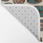 Vagabondâs Cupboard - black and cream with red, gold, teal, and peach Bath Mat Gallery Image 2