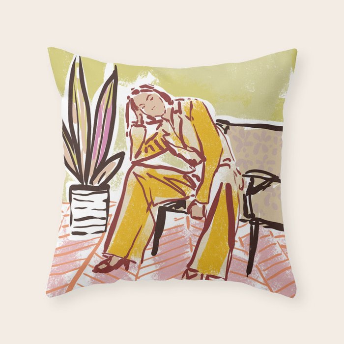 Woman sitting on sofa Throw Pillow Gallery Image 1