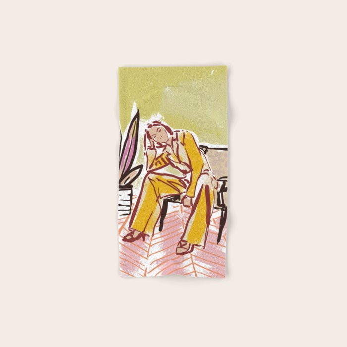 Woman sitting on sofa Bath Towel Gallery Image 1