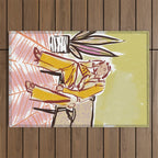 Woman sitting on sofa Outdoor Rug Gallery Image 1