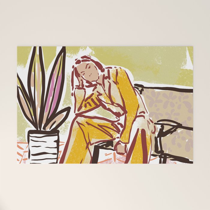 Woman sitting on sofa Welcome Mat Gallery Image 1