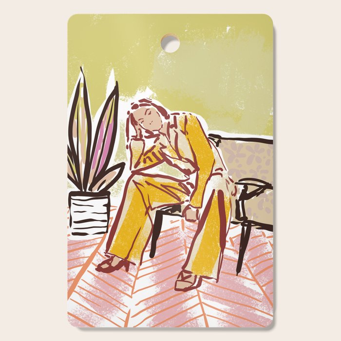 Woman sitting on sofa Cutting Board Gallery Image 1