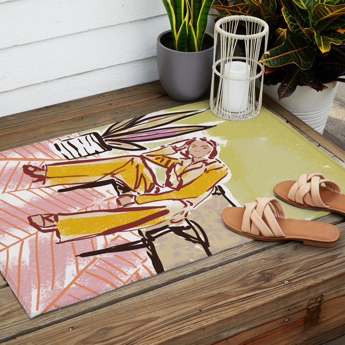 Woman sitting on sofa Outdoor Rug Gallery Image 2