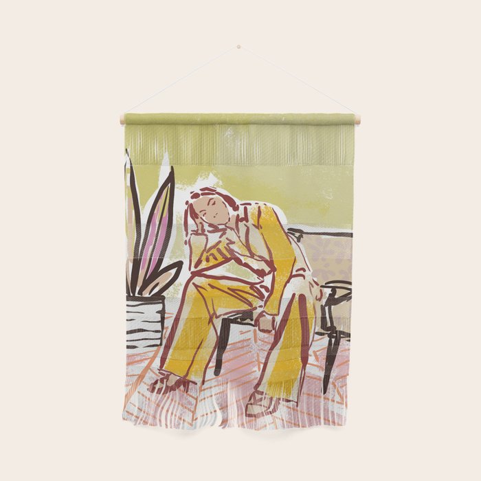 Woman sitting on sofa Wall Hanging Gallery Image 1