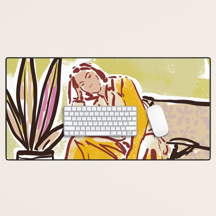 Woman sitting on sofa Desk Mat Gallery Image 1