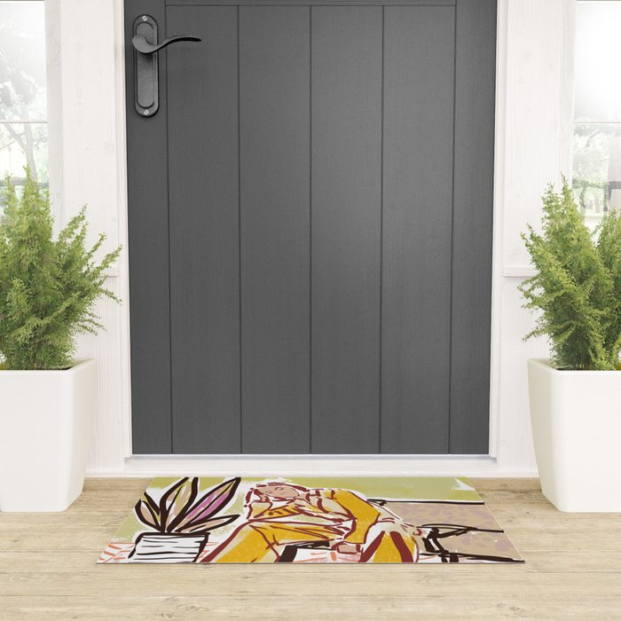 Woman sitting on sofa Welcome Mat Gallery Image 3