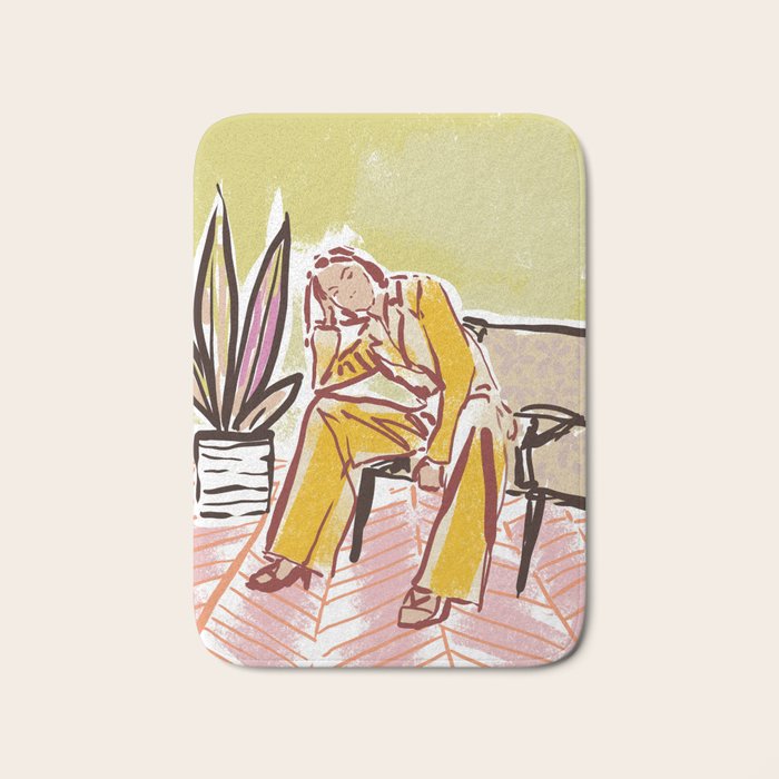 Woman sitting on sofa Bath Mat Gallery Image 1