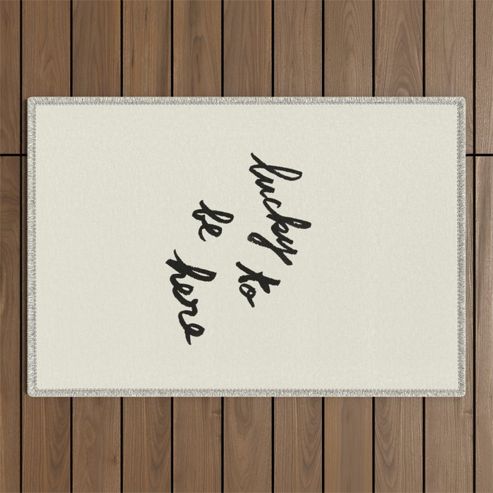 Lucky To Be Here - Brush Script Typography Quote  Outdoor Rug Gallery Image 1