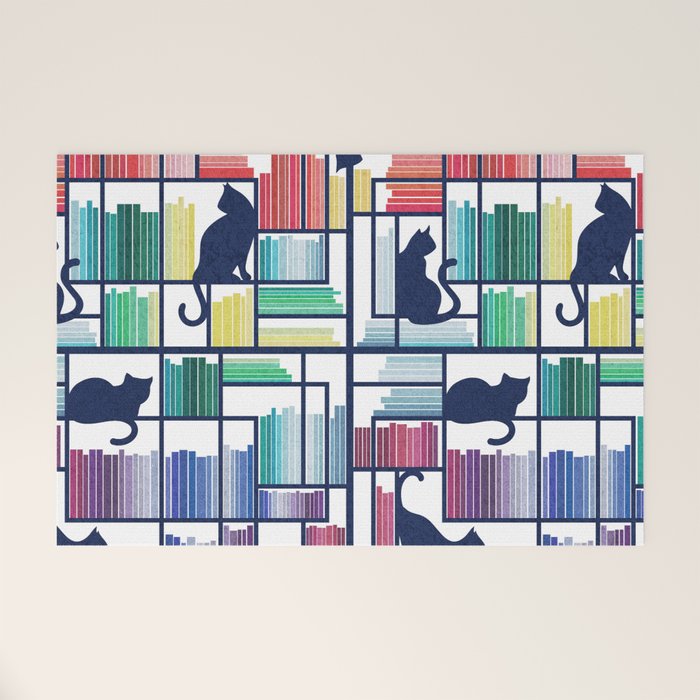 Rainbow bookshelf // white background navy blue shelf and library cats Welcome Mat