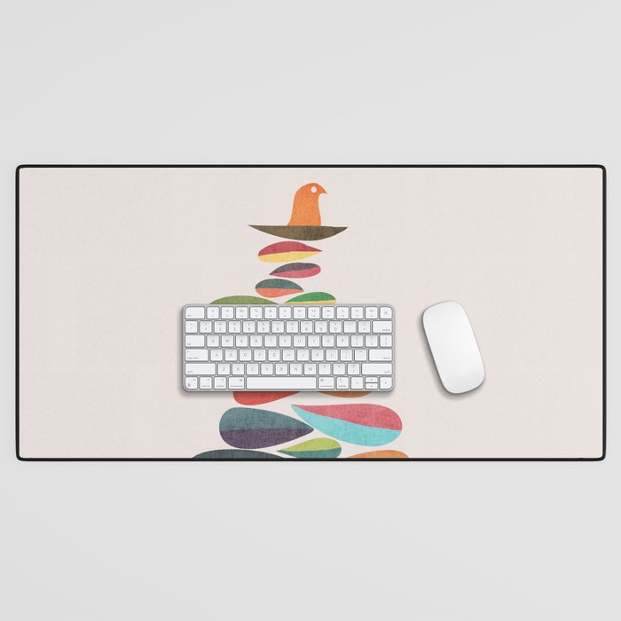 Bird nesting on top of pebbles hill Desk Mat Gallery Image 1
