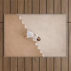 Girl Thinking on a Stairway Outdoor Rug Gallery Image 1