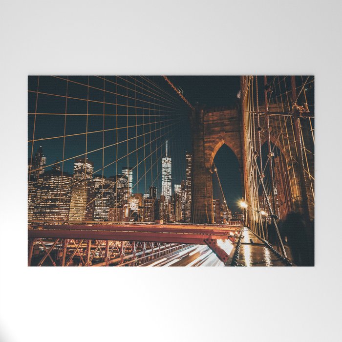 Brooklyn Bridge and Manhattan skyline in New York City at night Welcome Mat