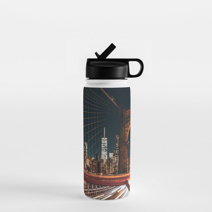 Brooklyn Bridge and Manhattan skyline in New York City at night Water Bottle
