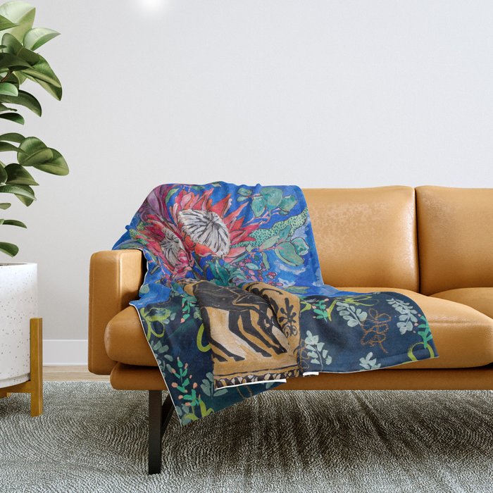 Painterly Bouquet of Proteas in Greek Horse Urn on Blue Throw Blanket Gallery Image 1