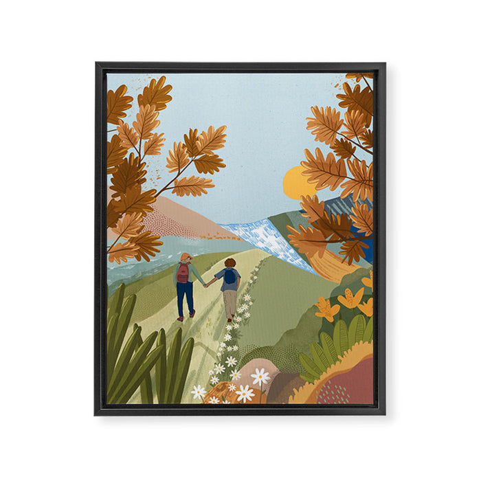 Couple Hiking Through colorful landscape Framed Canvas Print Gallery Image 1