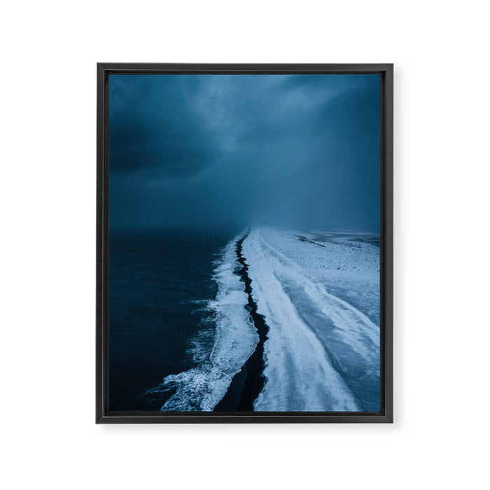 Black Sand Beach with snow in Iceland during a storm â Moody Landscape Photography Framed Canvas Print Gallery Image 1