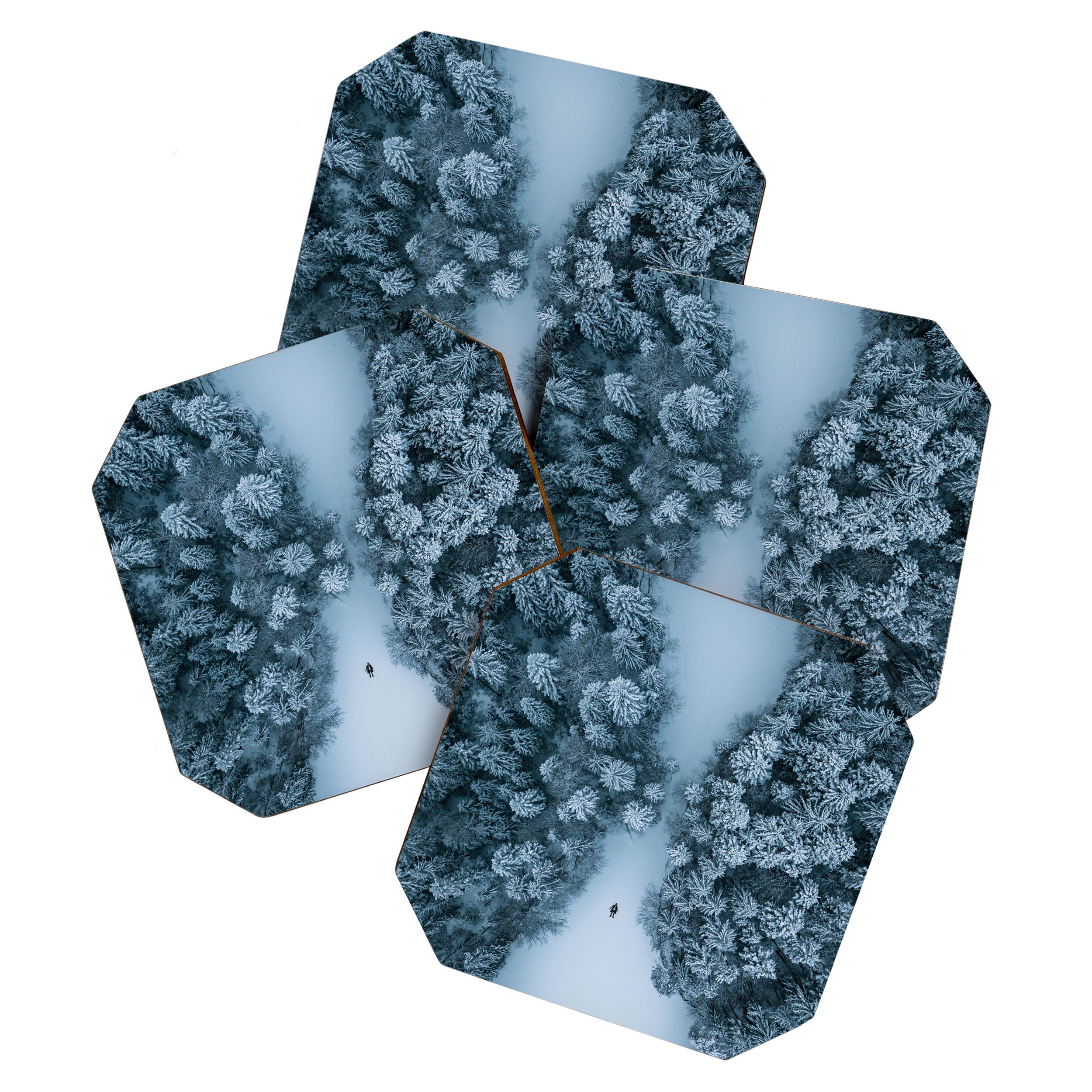 Man lying in the snow on a frozen lake in a winter forest - Landscape Photography Coaster Gallery Image 1