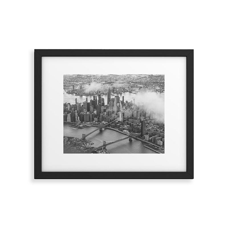 Manhattan Through The Clouds Framed Art Print