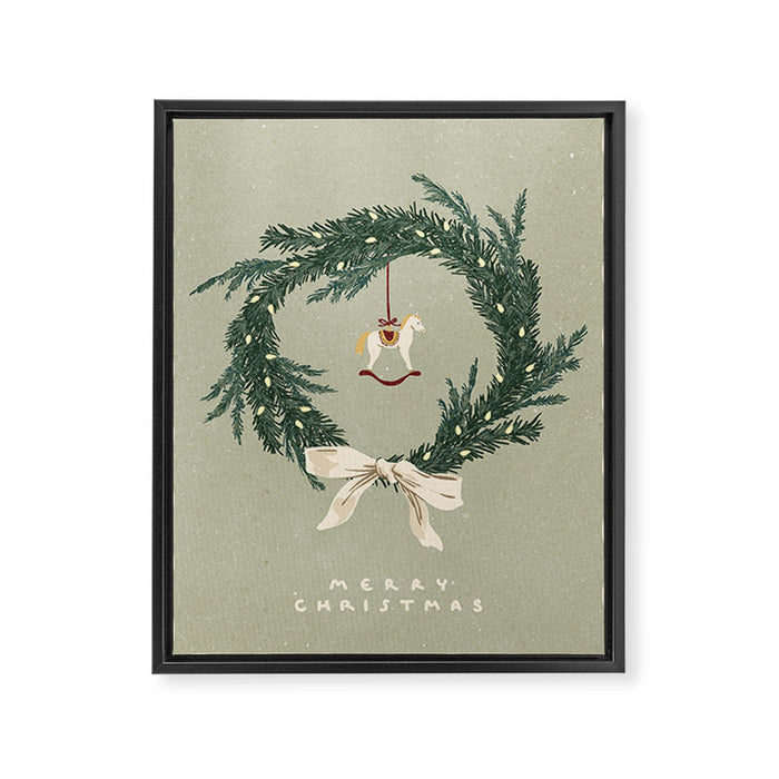Horses toy on Christmas wreath with bow Framed Canvas Print Gallery Image 1