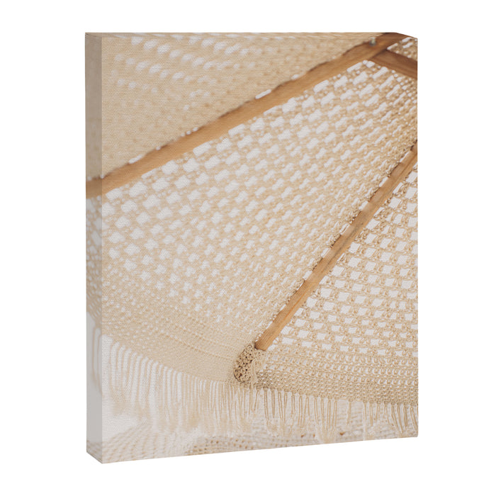 Boho crochet beach umbrella close-up, neutral minimalist summer photo Canvas Print Gallery Image 1