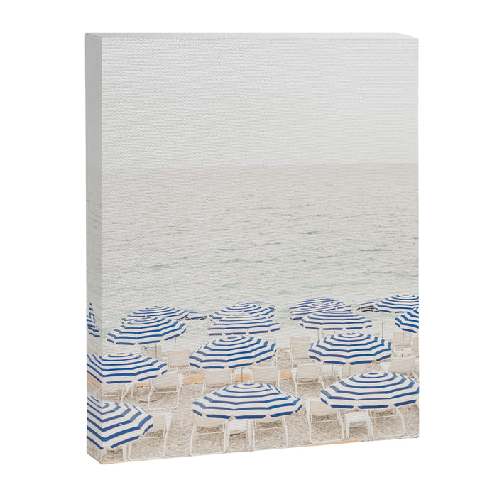 Blue Striped Umbrellas of the French Riviera | Nice, France beach photography Canvas Print Gallery Image 1