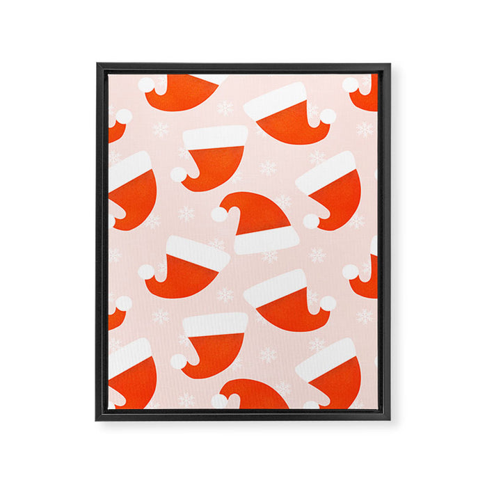 Santa Hats and Snowflakes on Pink Background Framed Canvas Print Gallery Image 1