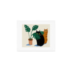 Black cat & orange tabby cat with Monstera plant Art Print Gallery Image 1