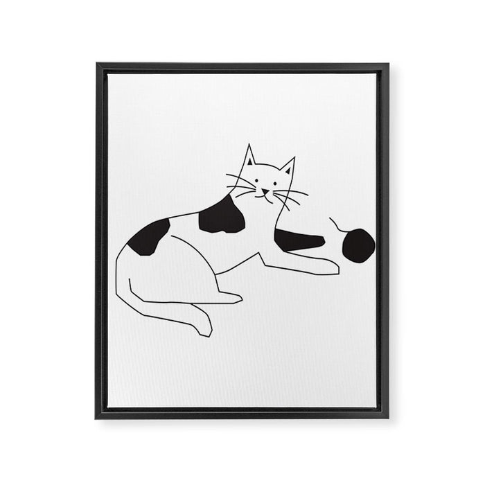 Black and white cat with yarn Framed Canvas Print Gallery Image 1
